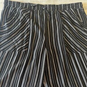 Black with white stripes, palazzo pants. Size XL.
